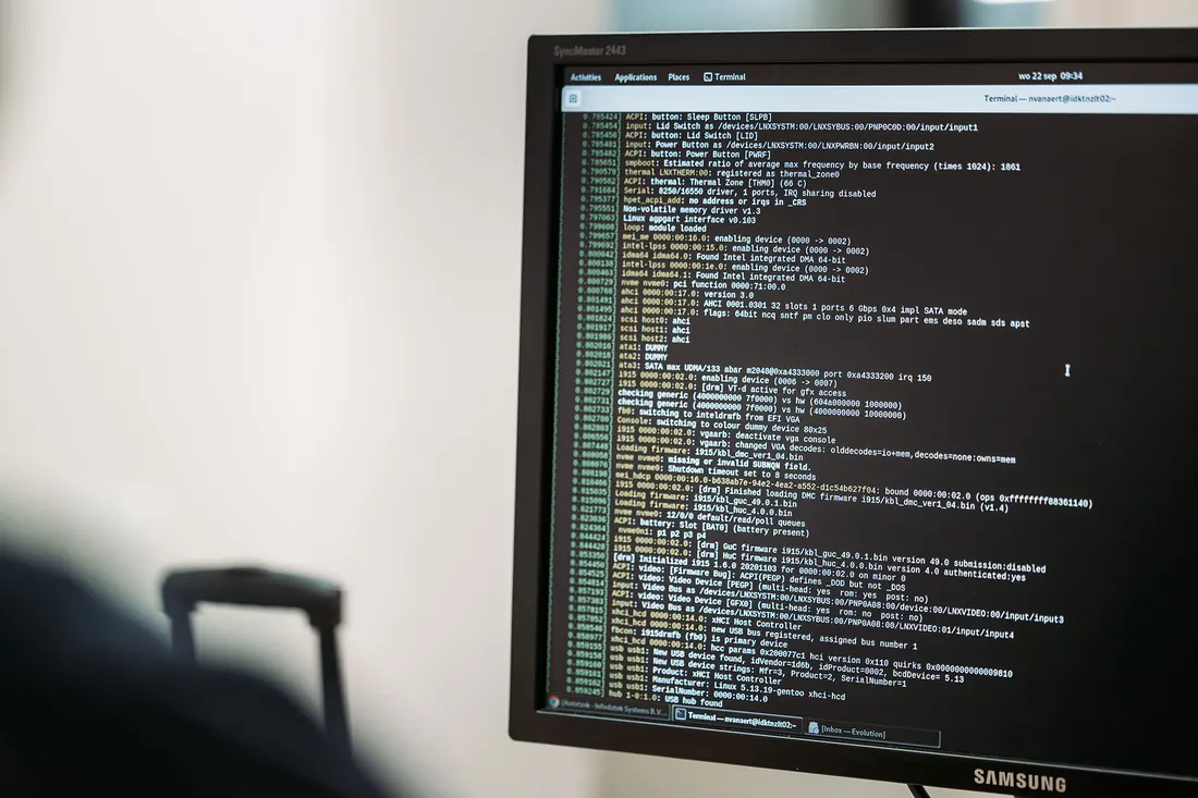 A screen full of system log lines, photographed up close.